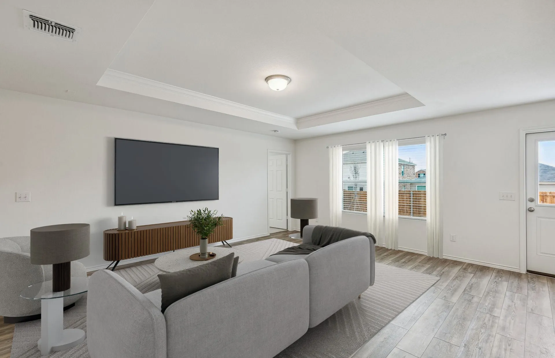 Spacious gathering room with large windows *Model Representation*
