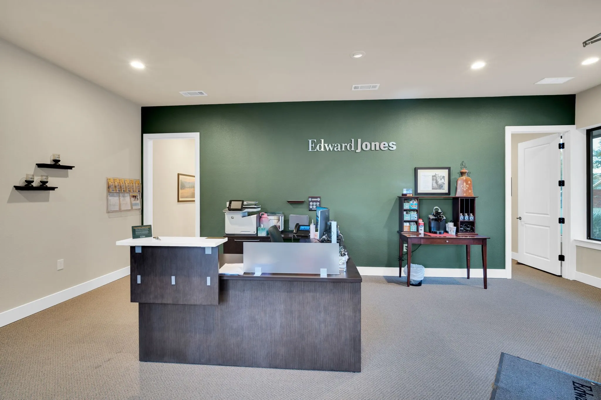 Welcoming reception area with a bold accent wall, setting a polished tone for clients and visitors.