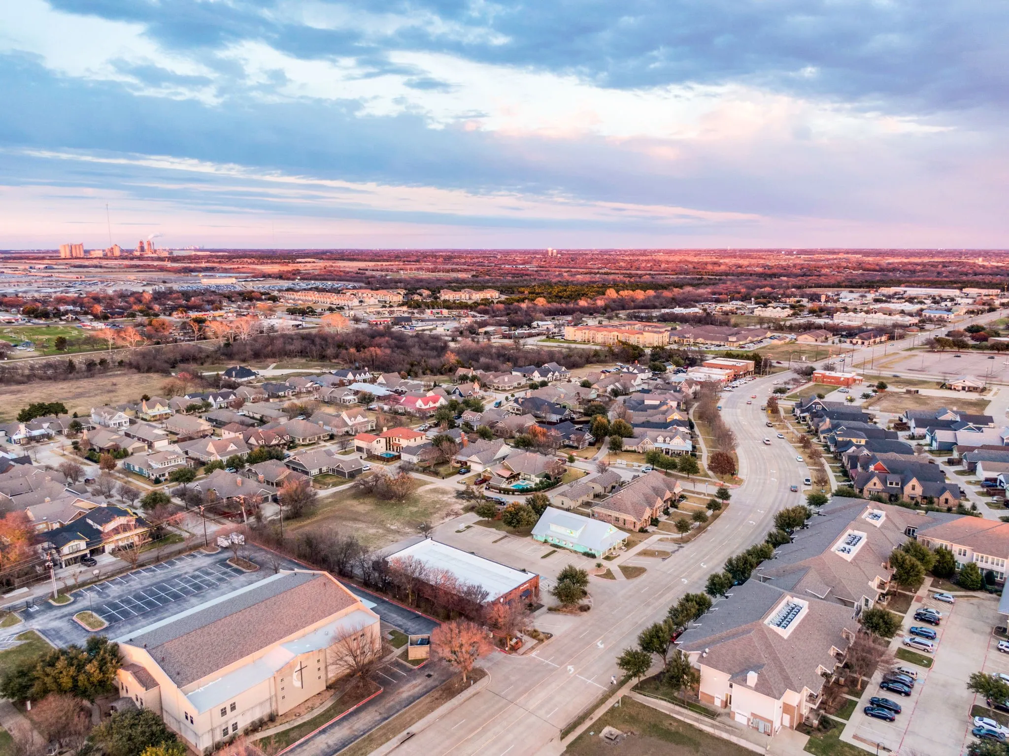 Aerial angle capturing the building's roofline and its prime positioning in the area.