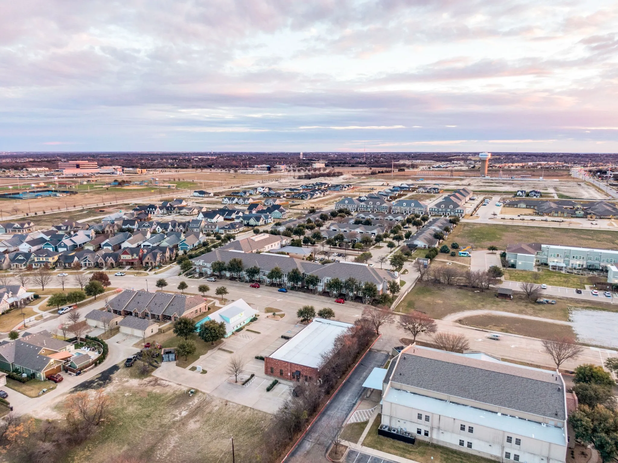 Aerial view showcasing the surrounding neighborhood and the building's accessible location.