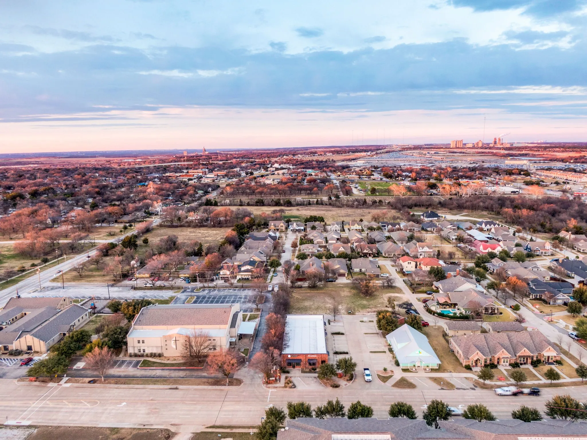 Aerial view highlighting the property's convenient access and neighboring development.