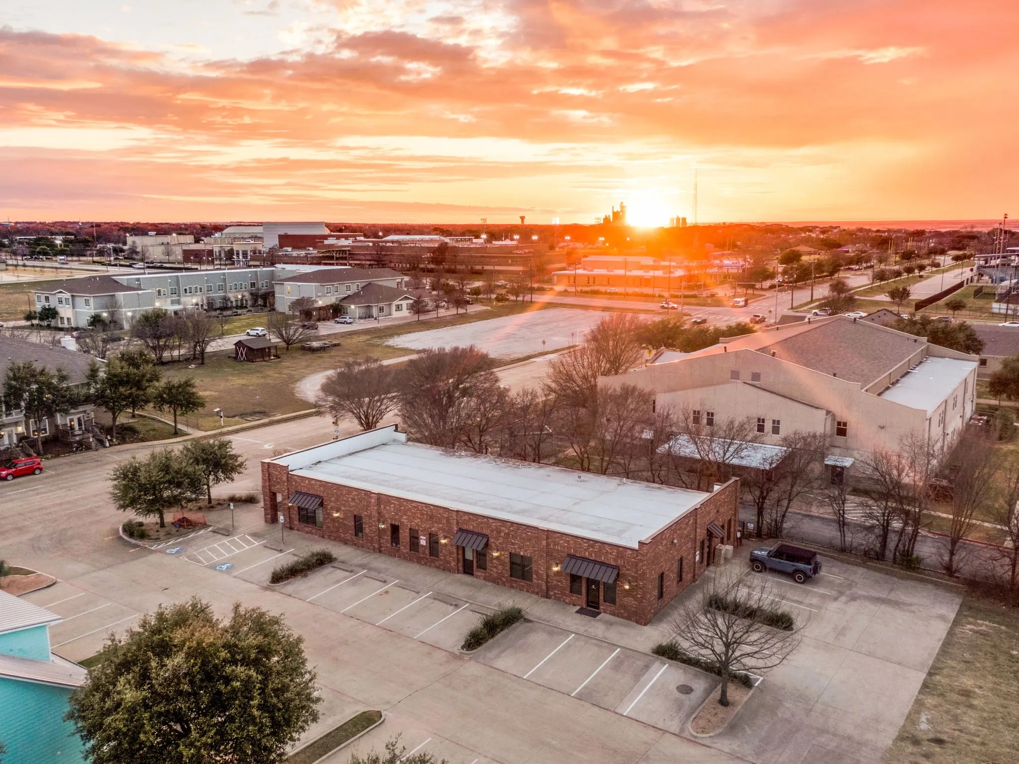 Aerial view capturing the building's full footprint and prime surrounding location.