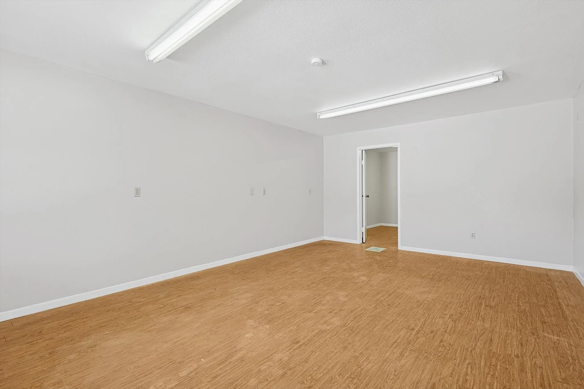 Unfurnished room featuring light hardwood / wood-style​​‌​​​​‌​​‌‌​‌‌​​​‌‌​‌​‌​‌​​​‌​​ floors