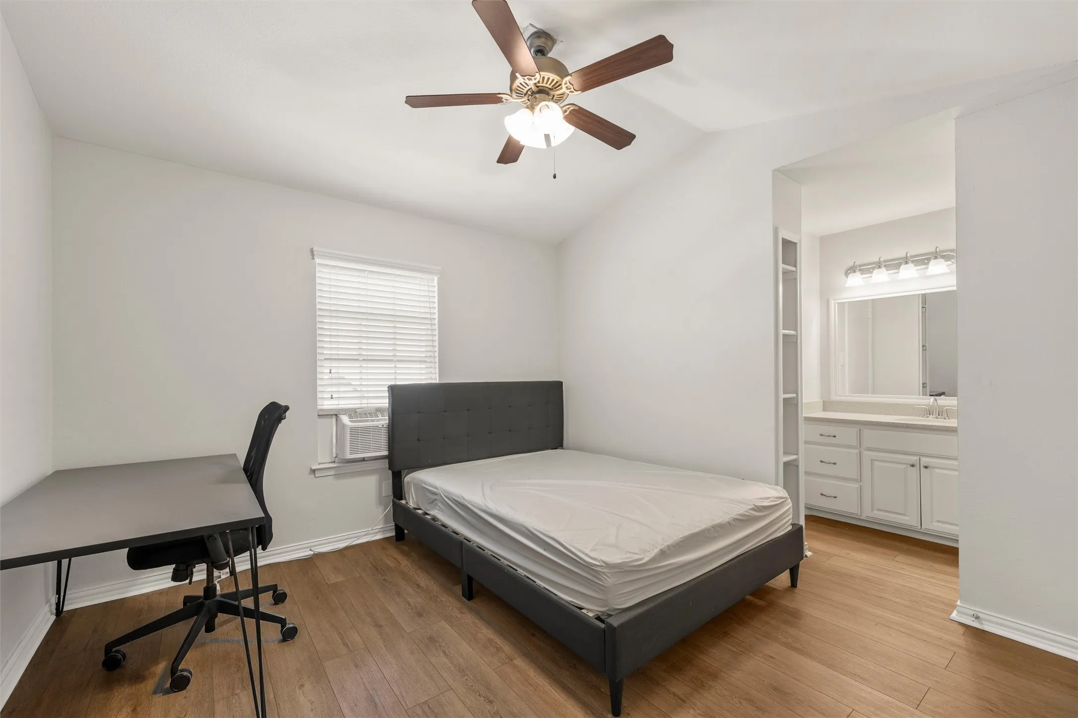 The largest bedroom has a cathedral ceiling, private bath, and several closets.