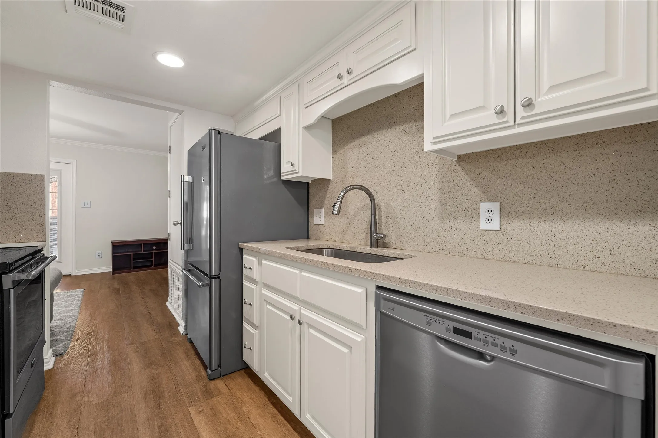 Updated kitchen with stainless steel appliances. Even the dishes, glasses, and silverware are included!
