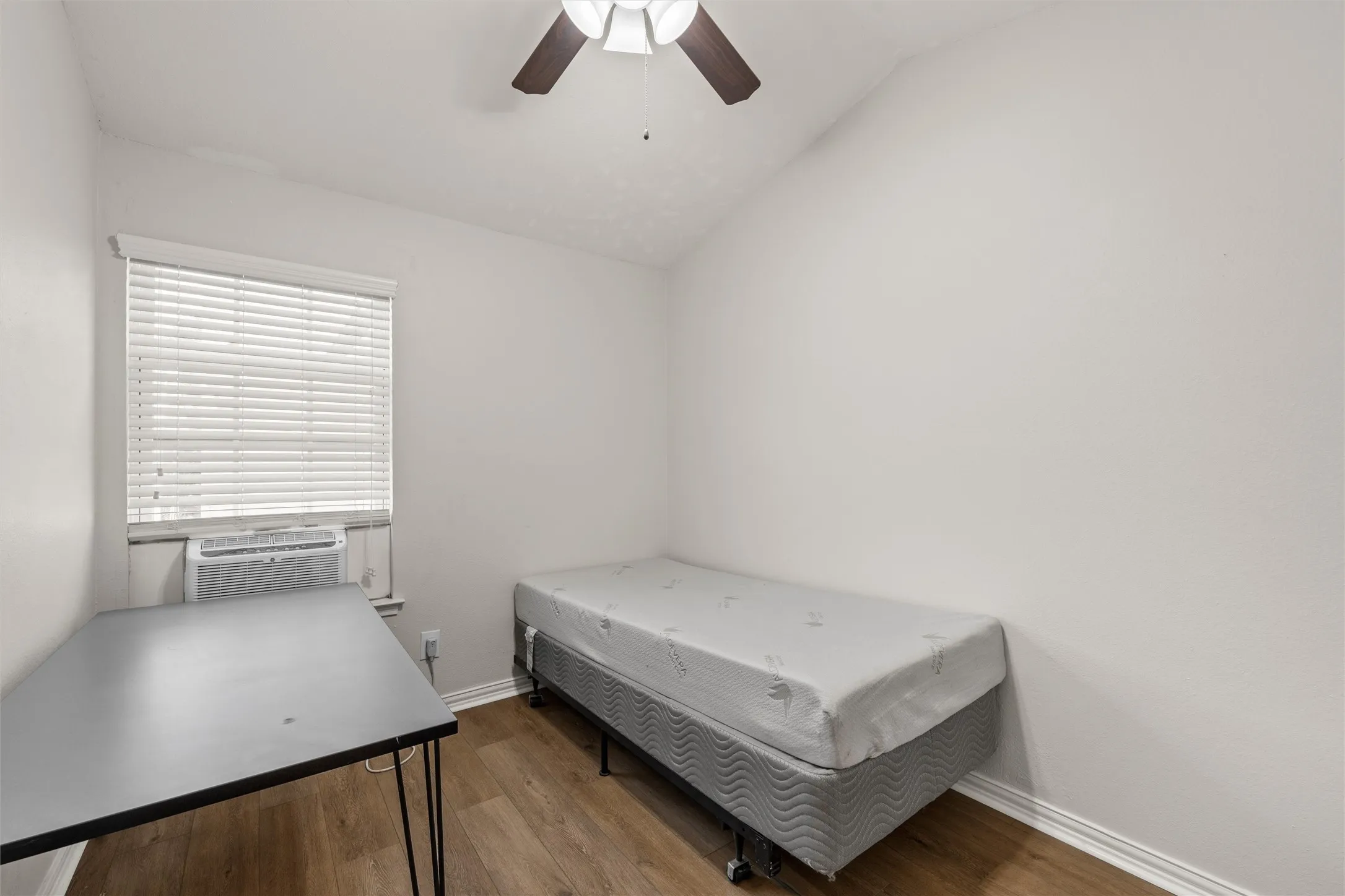 Bedroom 3. Cathedral ceiling, ceiling fan, and walk-in closet.