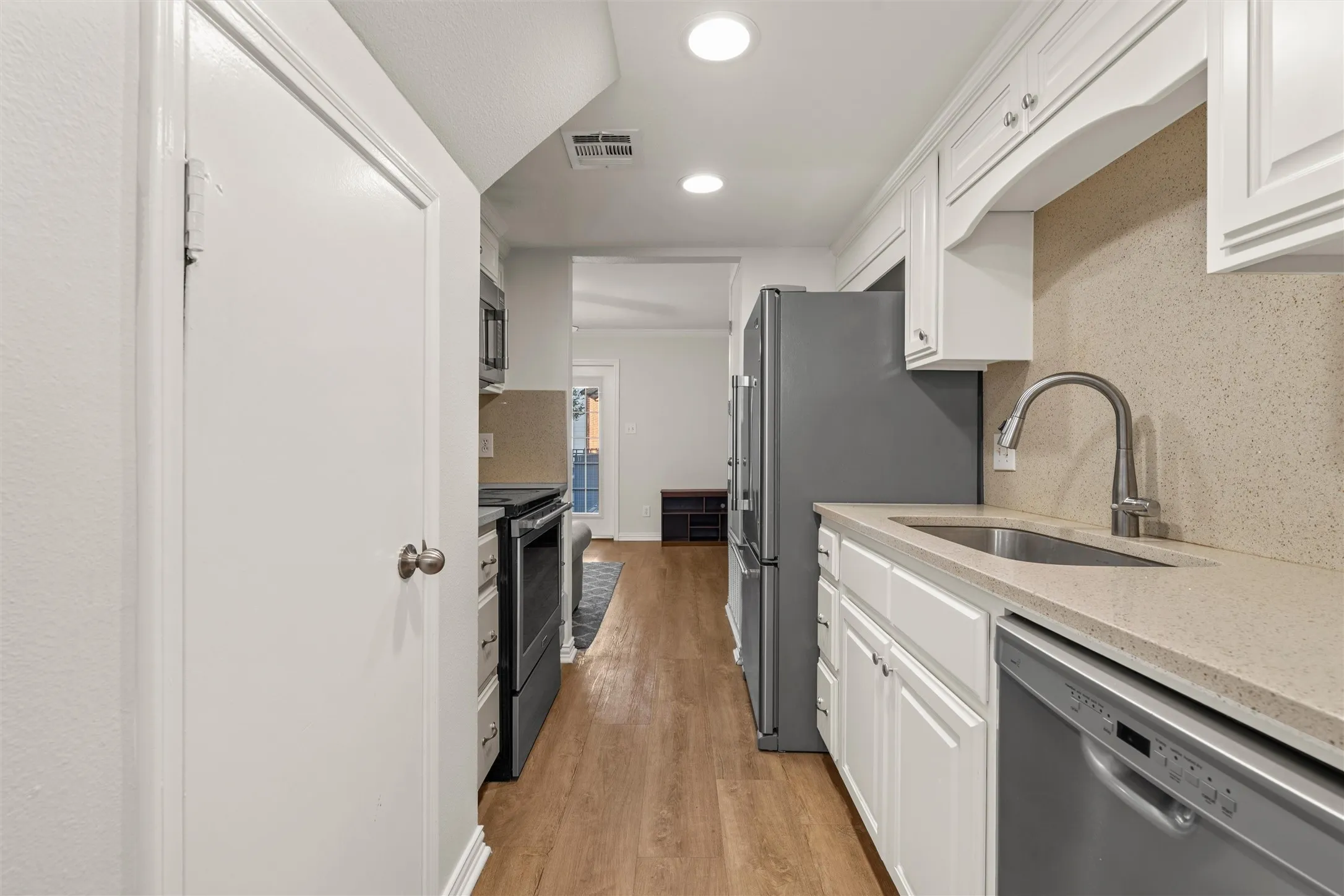 Updated kitchen with stainless steel appliances. Even the dishes, glasses, and silverware are included!