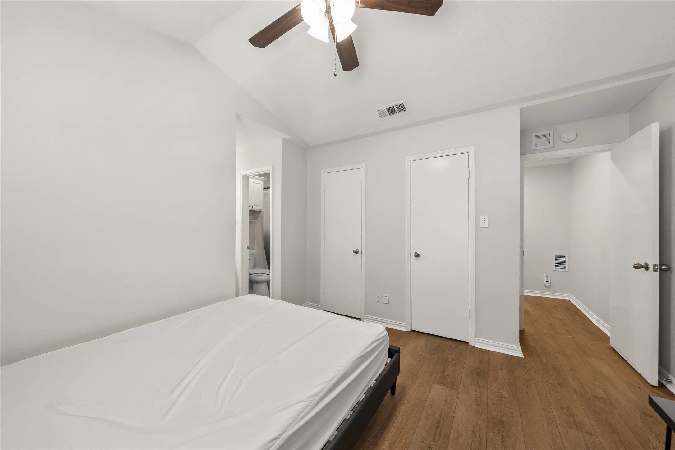 The largest bedroom has a cathedral ceiling, private bath, and several closets.
