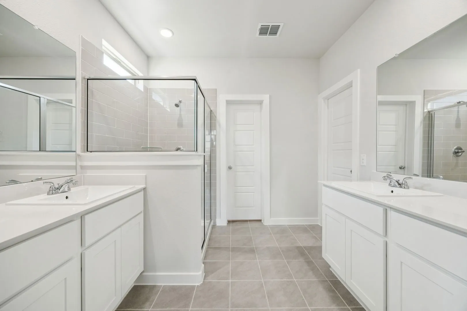 Primary Bathroom in the Masters home plan by Trophy Signature Homes – REPRESENTATIVE PHOTO