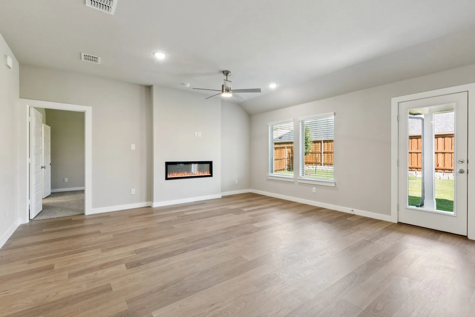 Living Room in the Emmy II home plan by Trophy Signature Homes - REPRESENTATIVE PHOTO