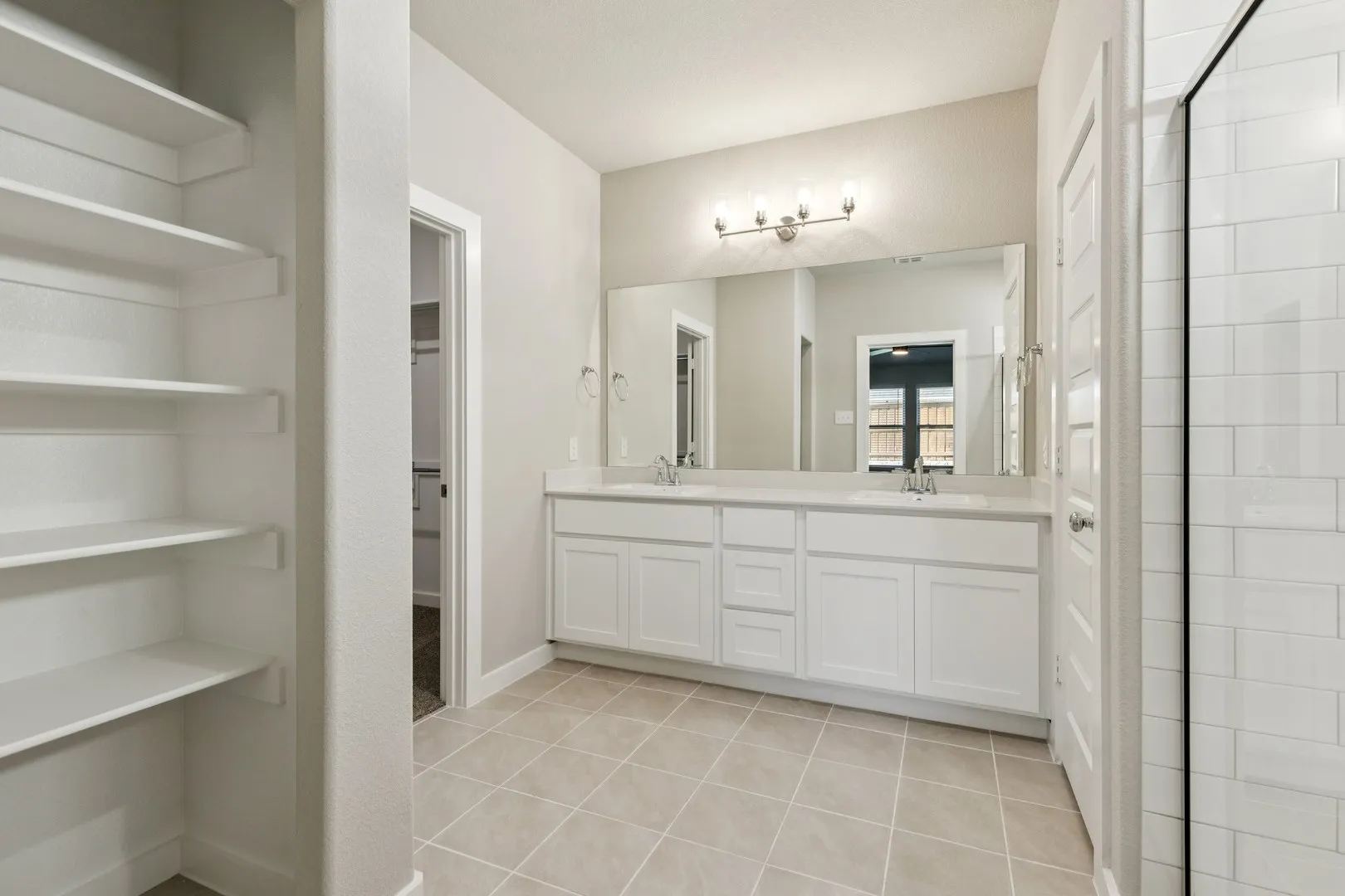Primary Bathroom in the Emmy II home plan by Trophy Signature Homes - REPRESENTATIVE PHOTO