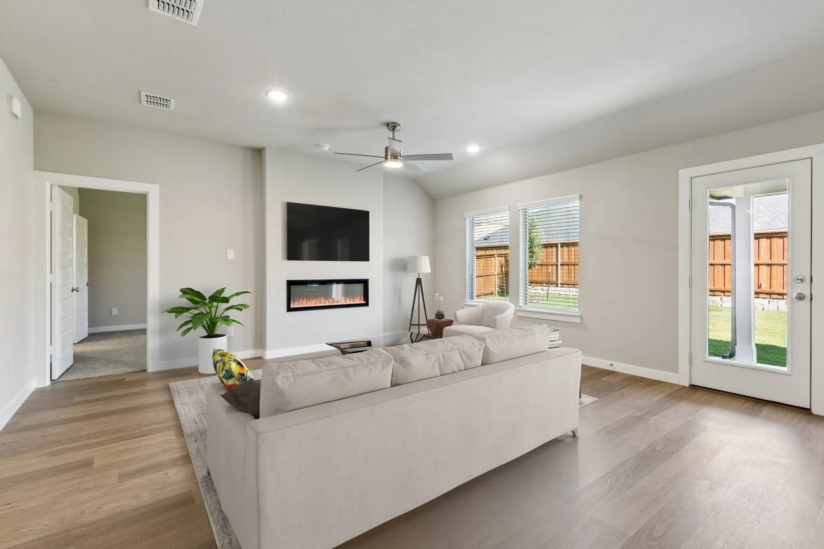 Living Room in the Emmy II home plan by Trophy Signature Homes - REPRESENTATIVE PHOTO