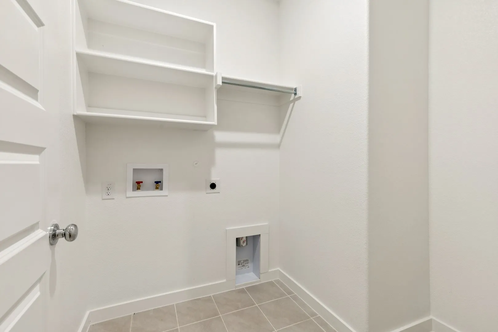 Utility Room in the Emmy II home plan by Trophy Signature Homes - REPRESENTATIVE PHOTO