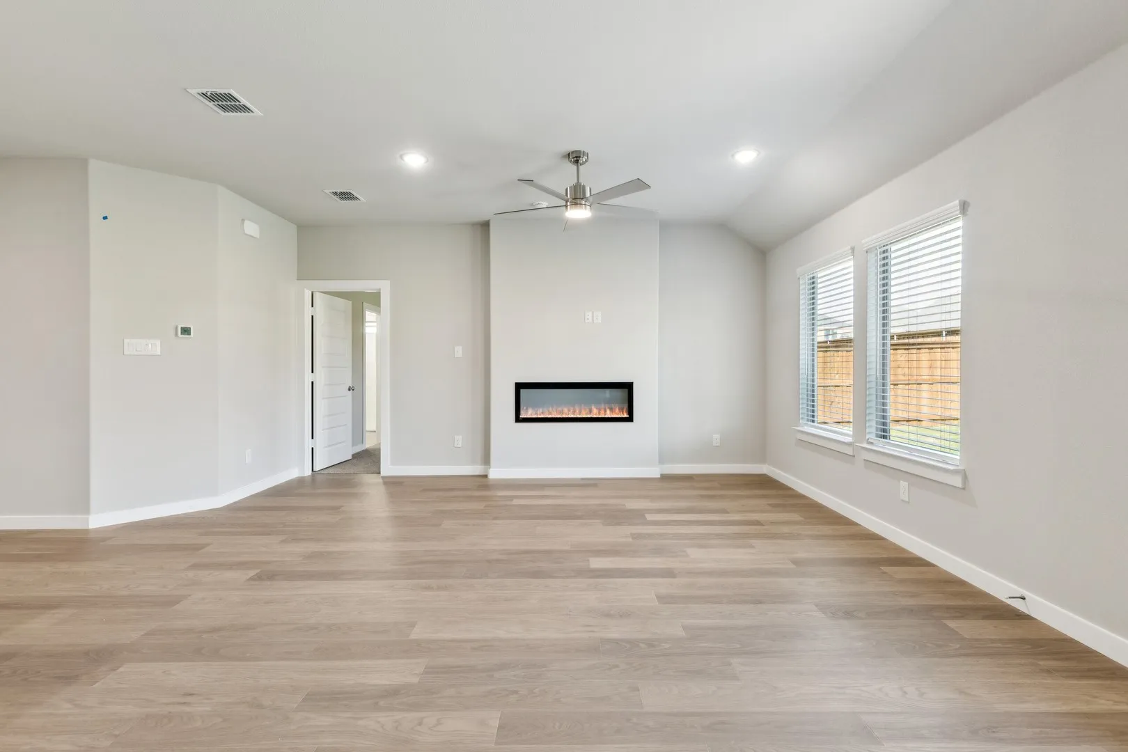 Living Room in the Emmy II home plan by Trophy Signature Homes - REPRESENTATIVE PHOTO
