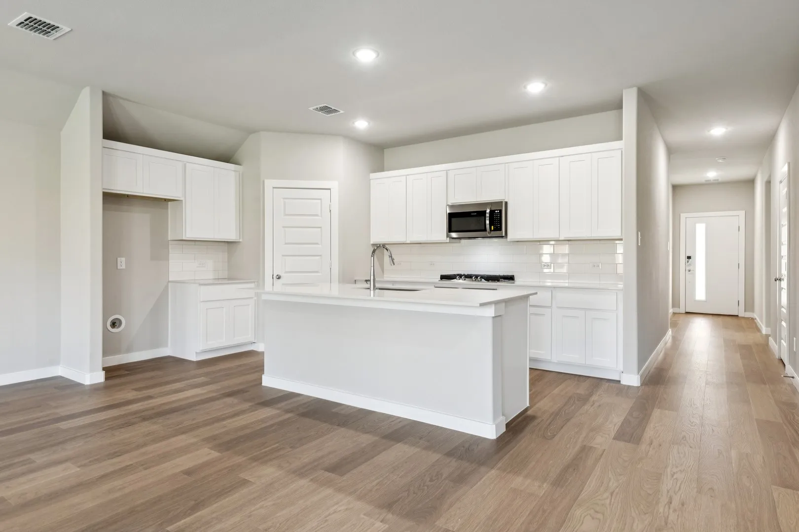 Kitchen in the Emmy II home plan by Trophy Signature Homes - REPRESENTATIVE PHOTO