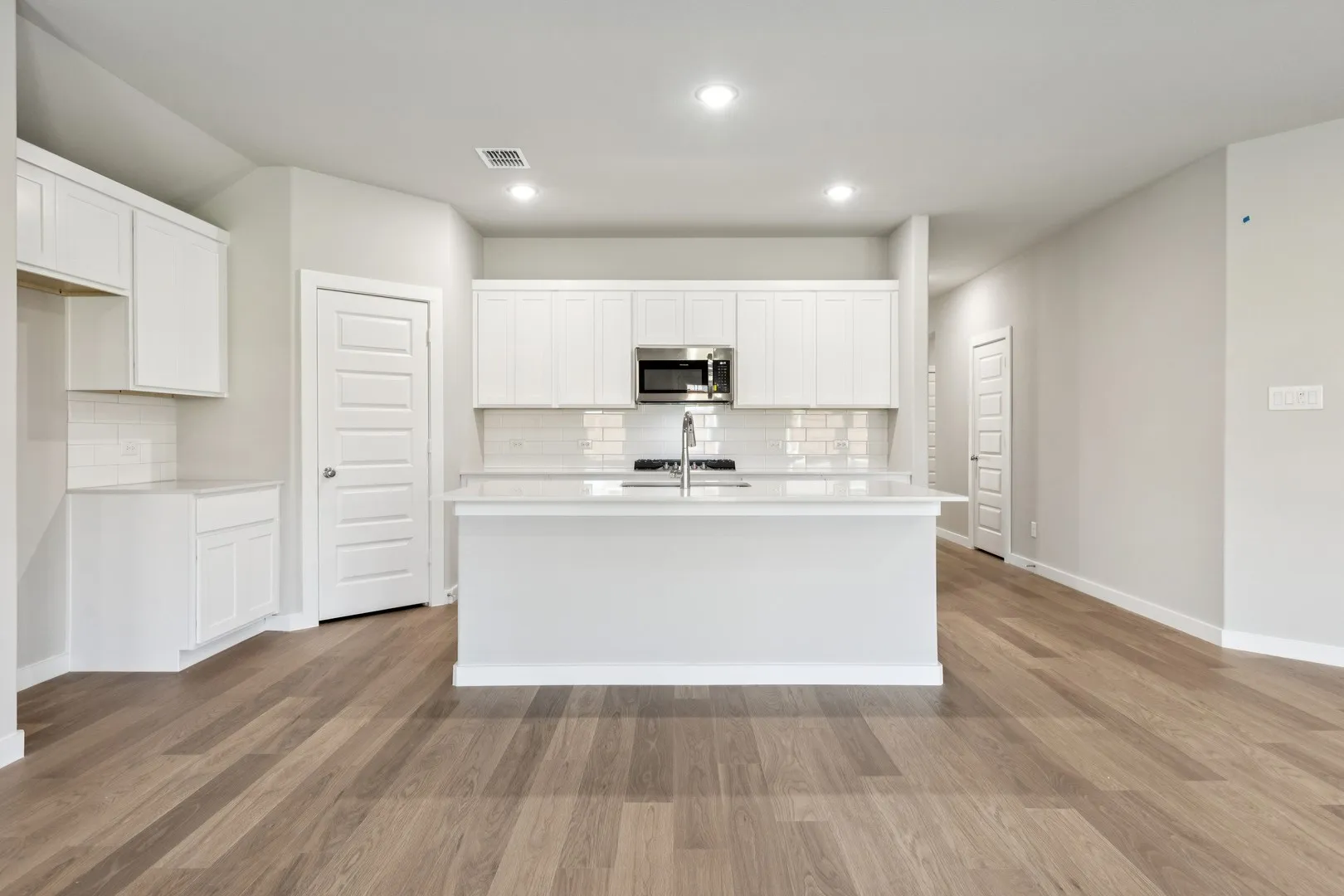 Kitchen in the Emmy II home plan by Trophy Signature Homes - REPRESENTATIVE PHOTO
