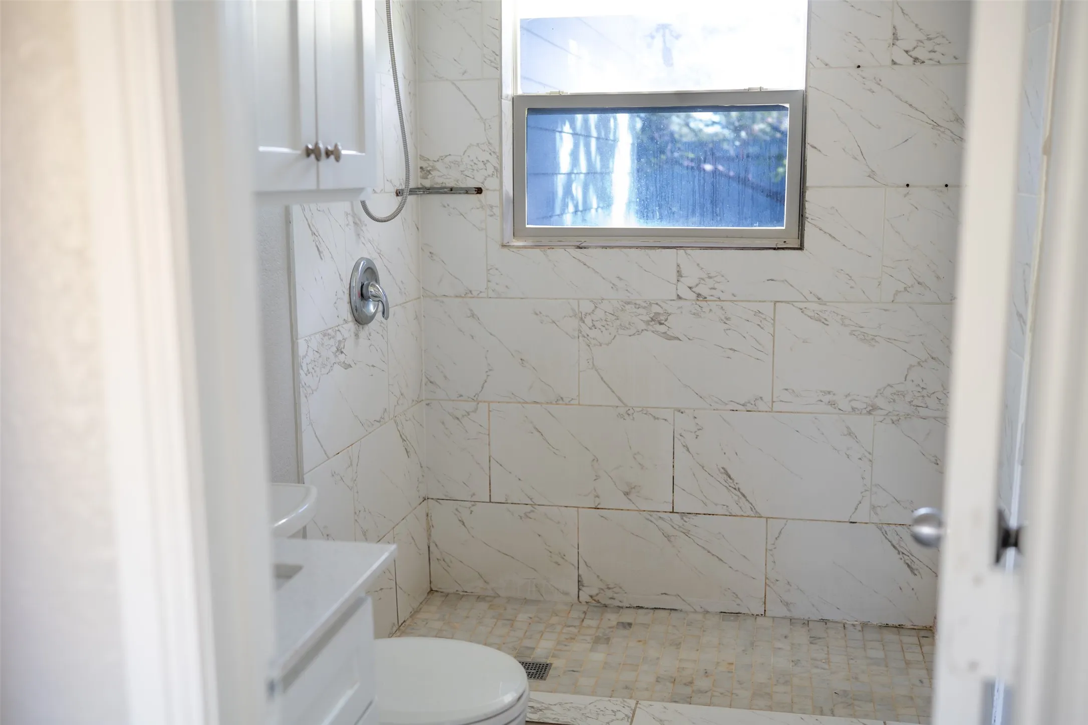 Full bath featuring vanity and a stall shower