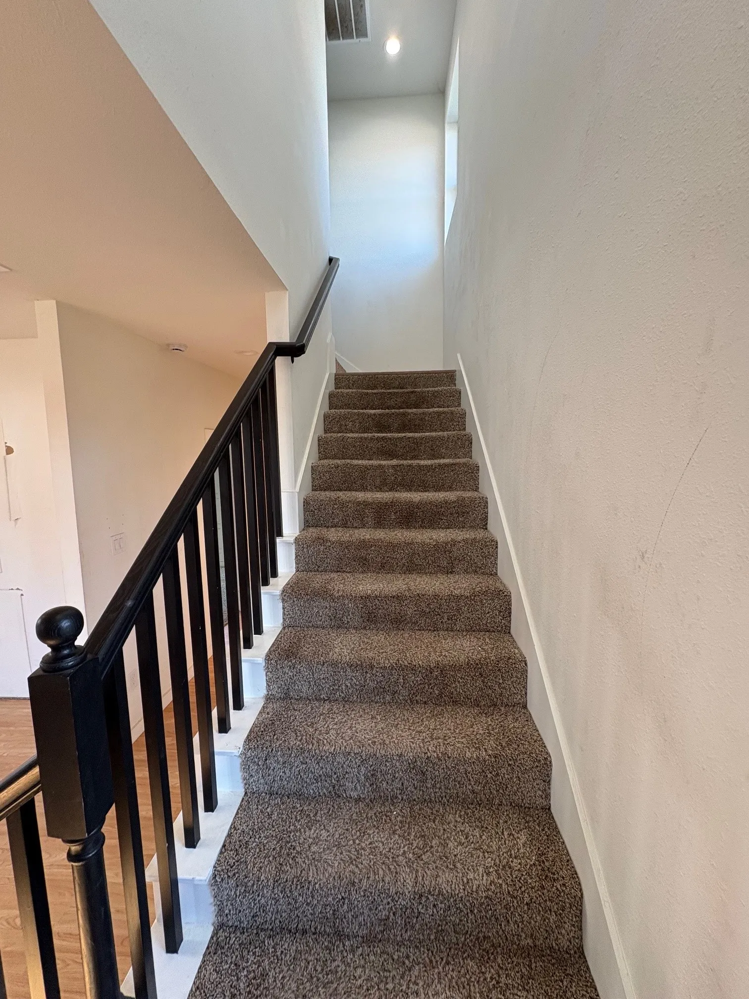 Stairs lead to upstairs bedroom and bath.