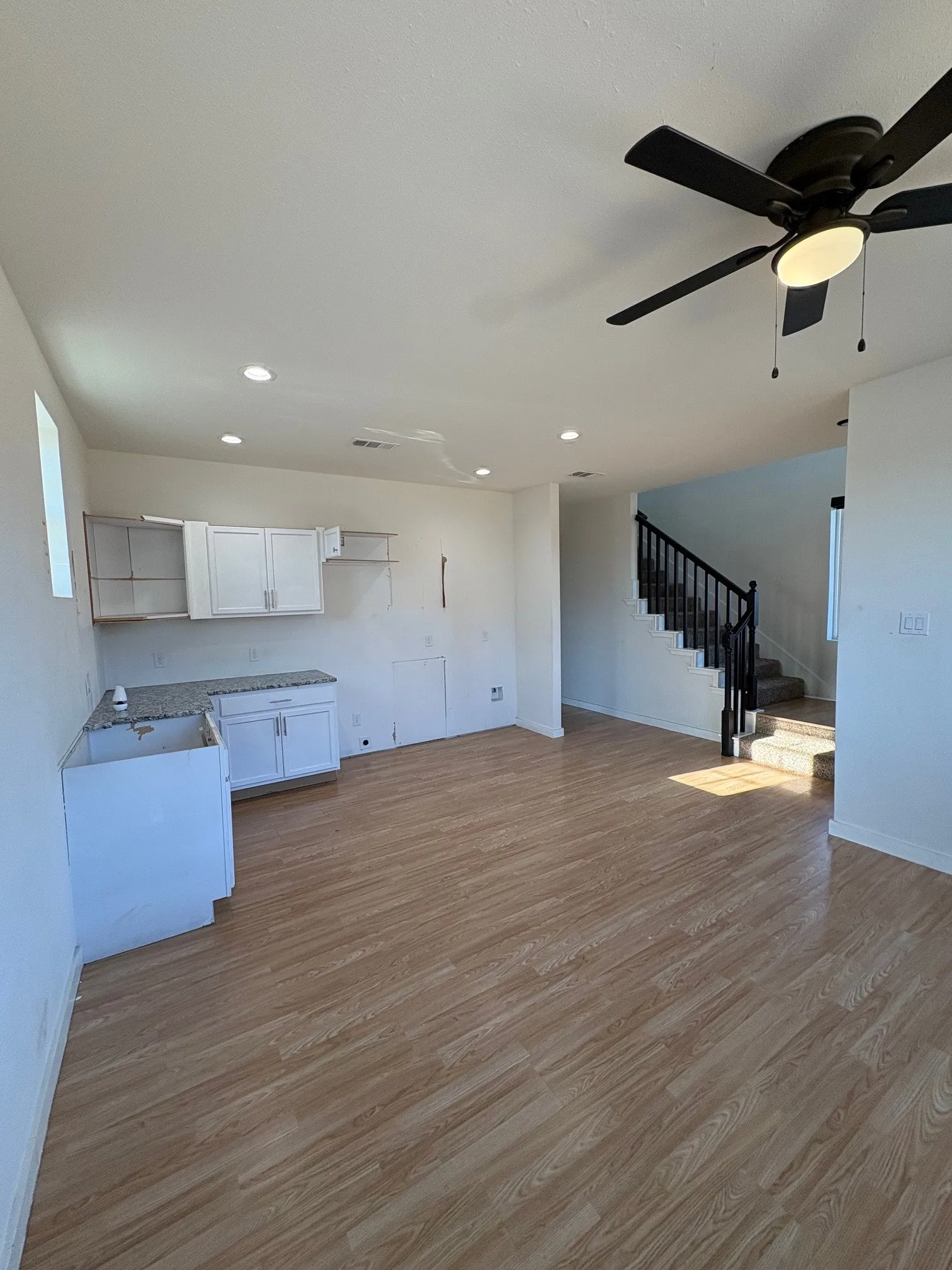Kitchen is open to living area and dining area.  Recessed lighting.