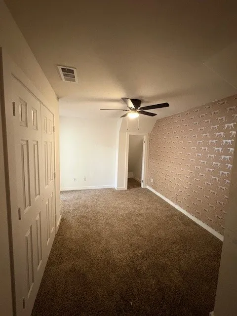 Bedroom one with multiple closets and ceiling fan is located on 2nd floor.