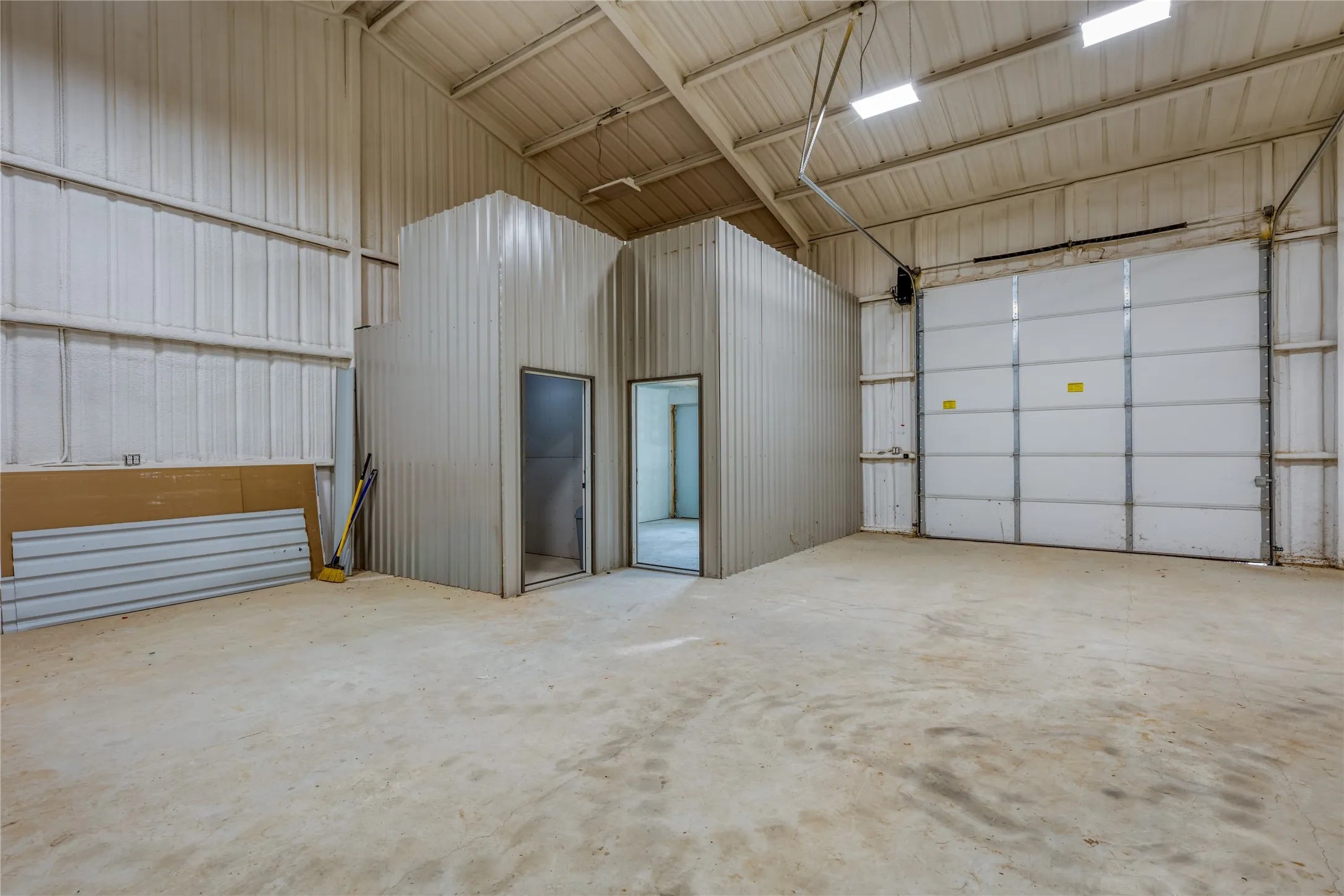 Garage featuring metal wall