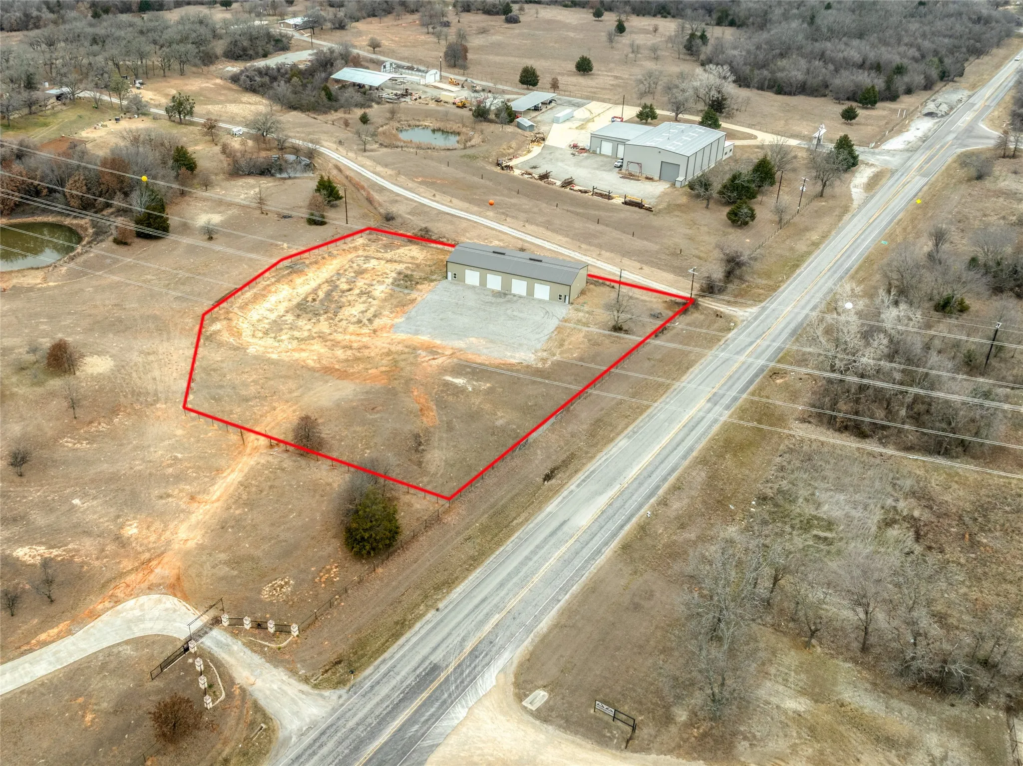 Aerial view of sparsely populated area with property boundaries highlighted