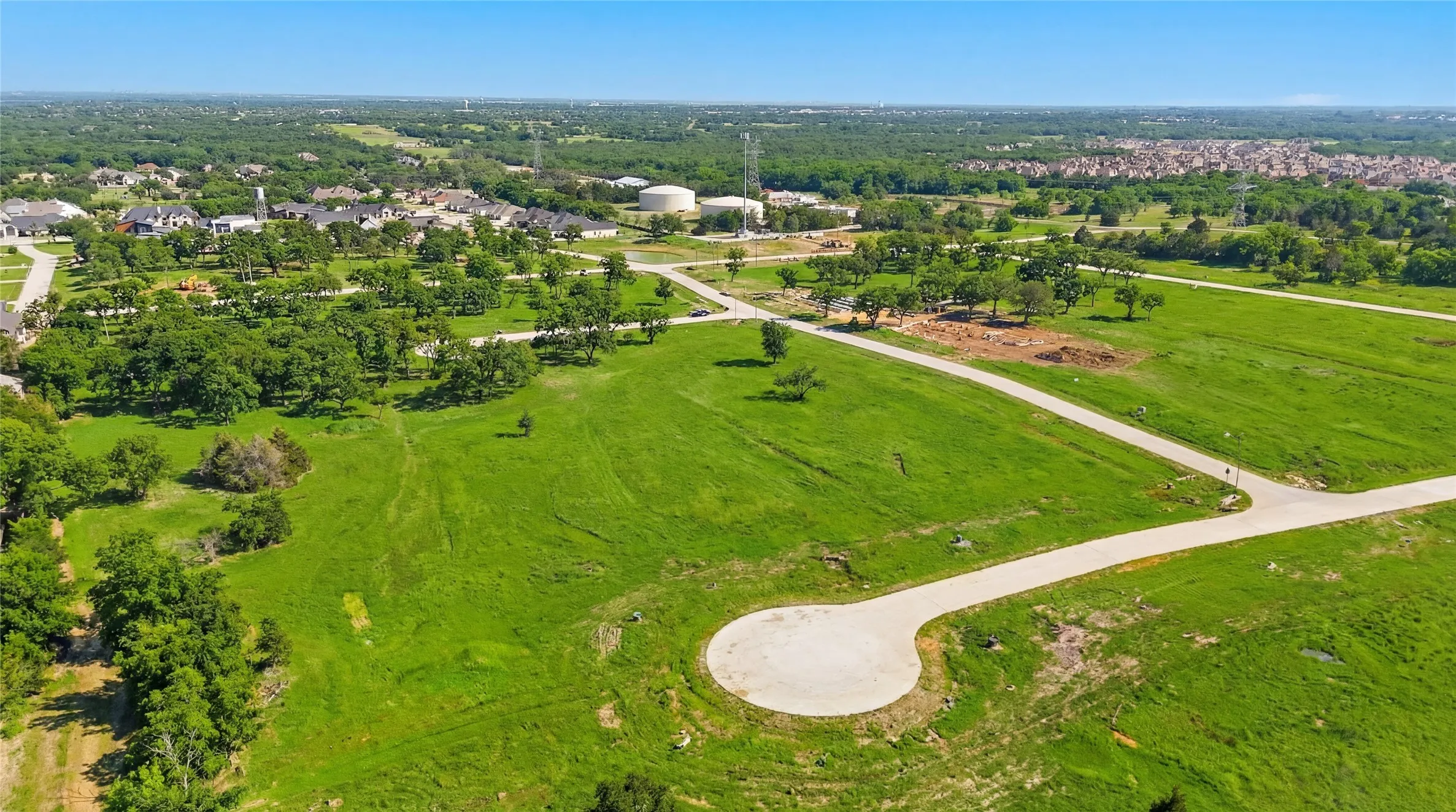This is a photograph of the community and was captured in February. It has been digitally enhanced to emphasize the presence of leaves and grass.