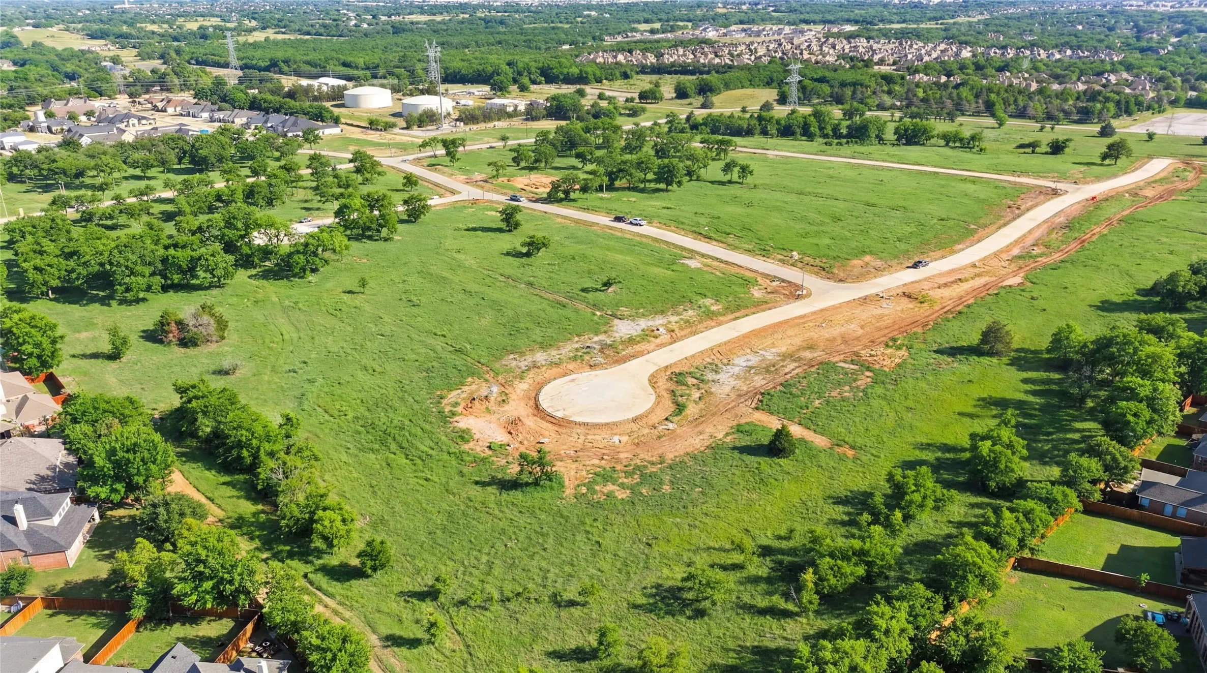 This is a photograph of the community and was captured in February. It has been digitally enhanced to emphasize the presence of leaves and grass.