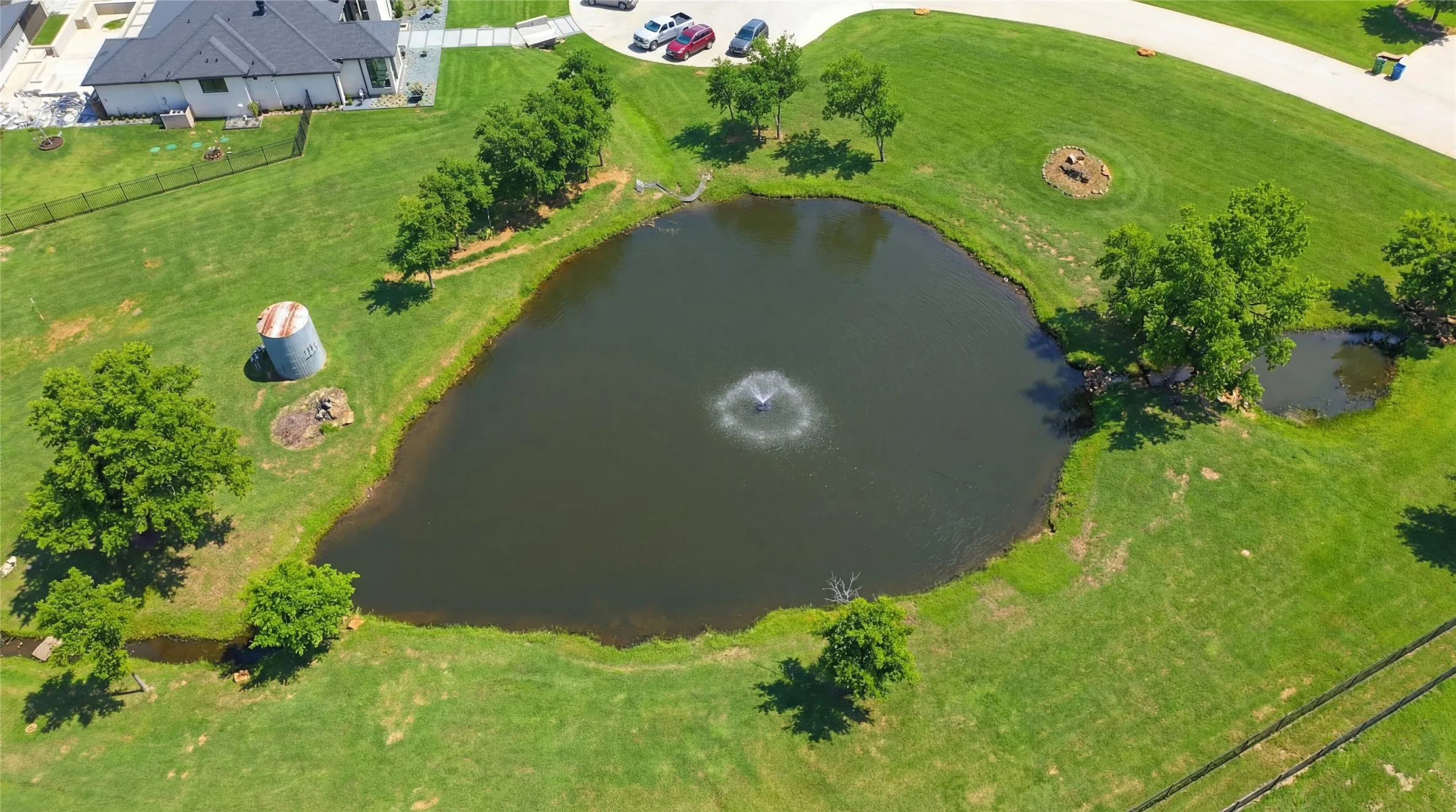 This is a photograph of the community and was captured in February. It has been digitally enhanced to emphasize the presence of leaves and grass.