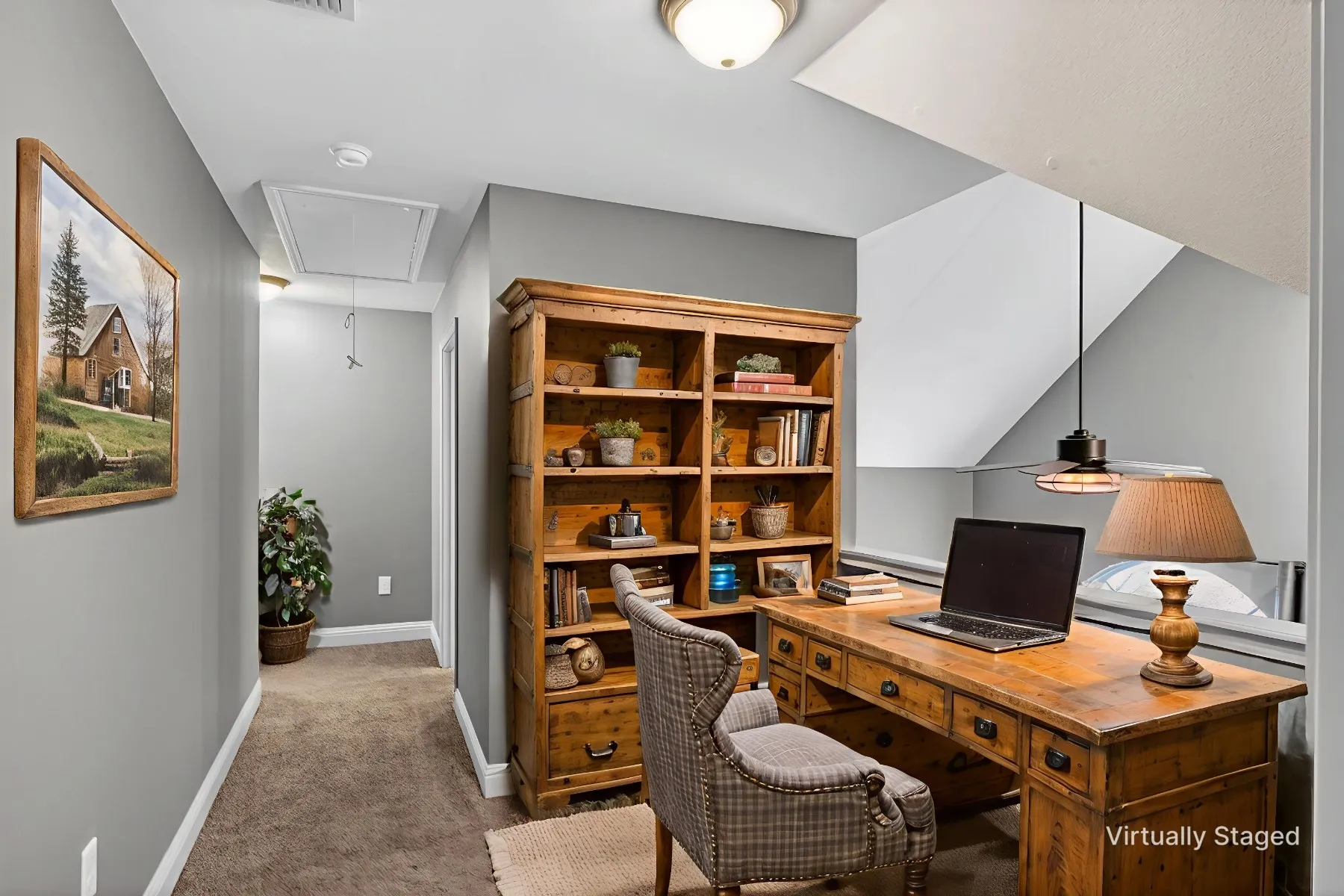 Office area featuring light carpet and attic access