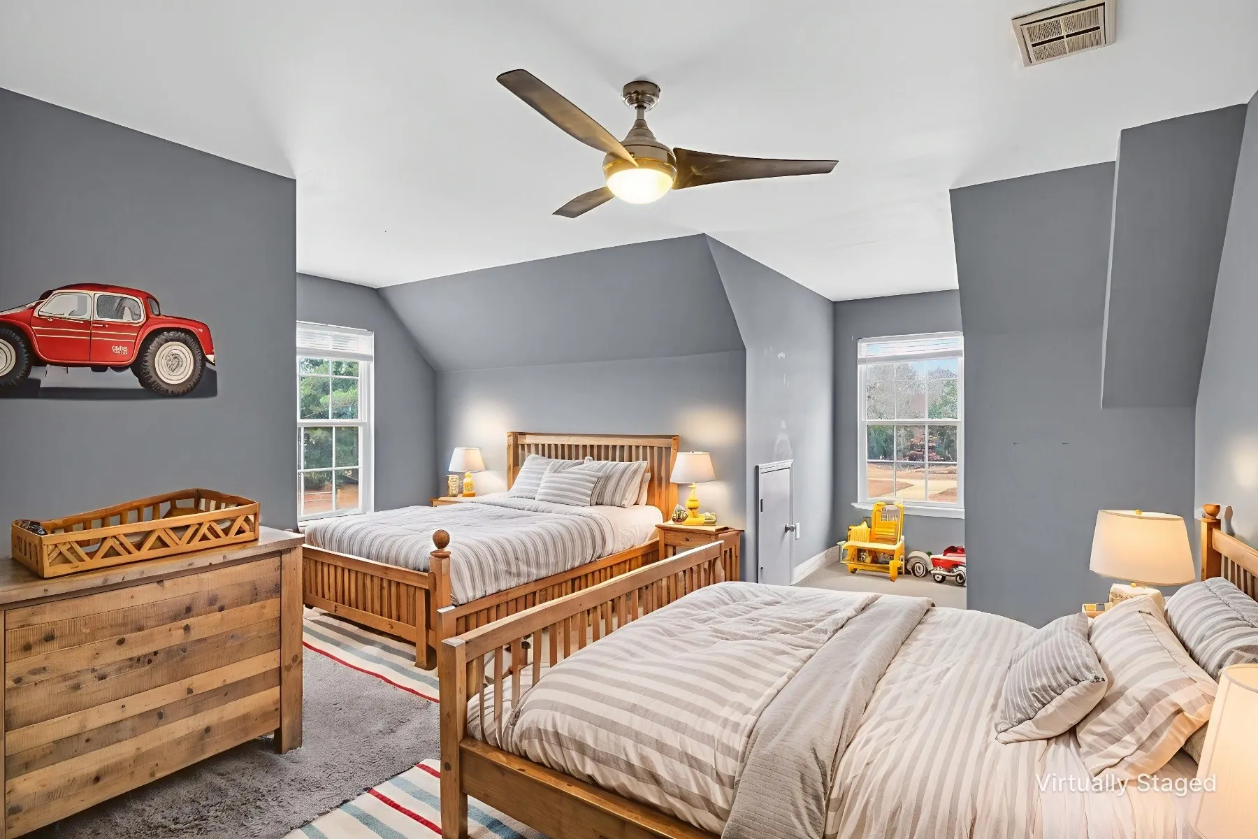 Bedroom featuring vaulted ceiling, ceiling fan, and carpet