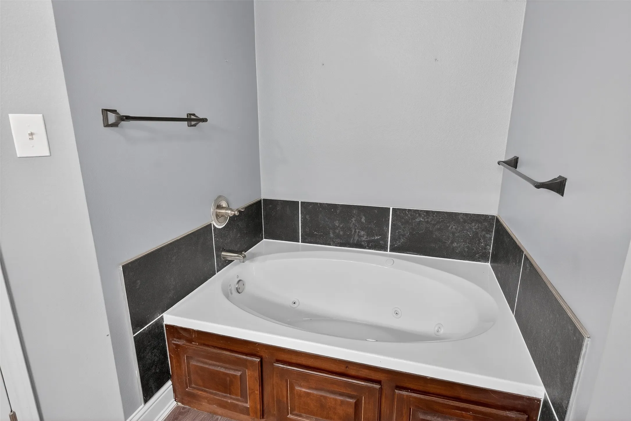 Full bath featuring a tub with jets