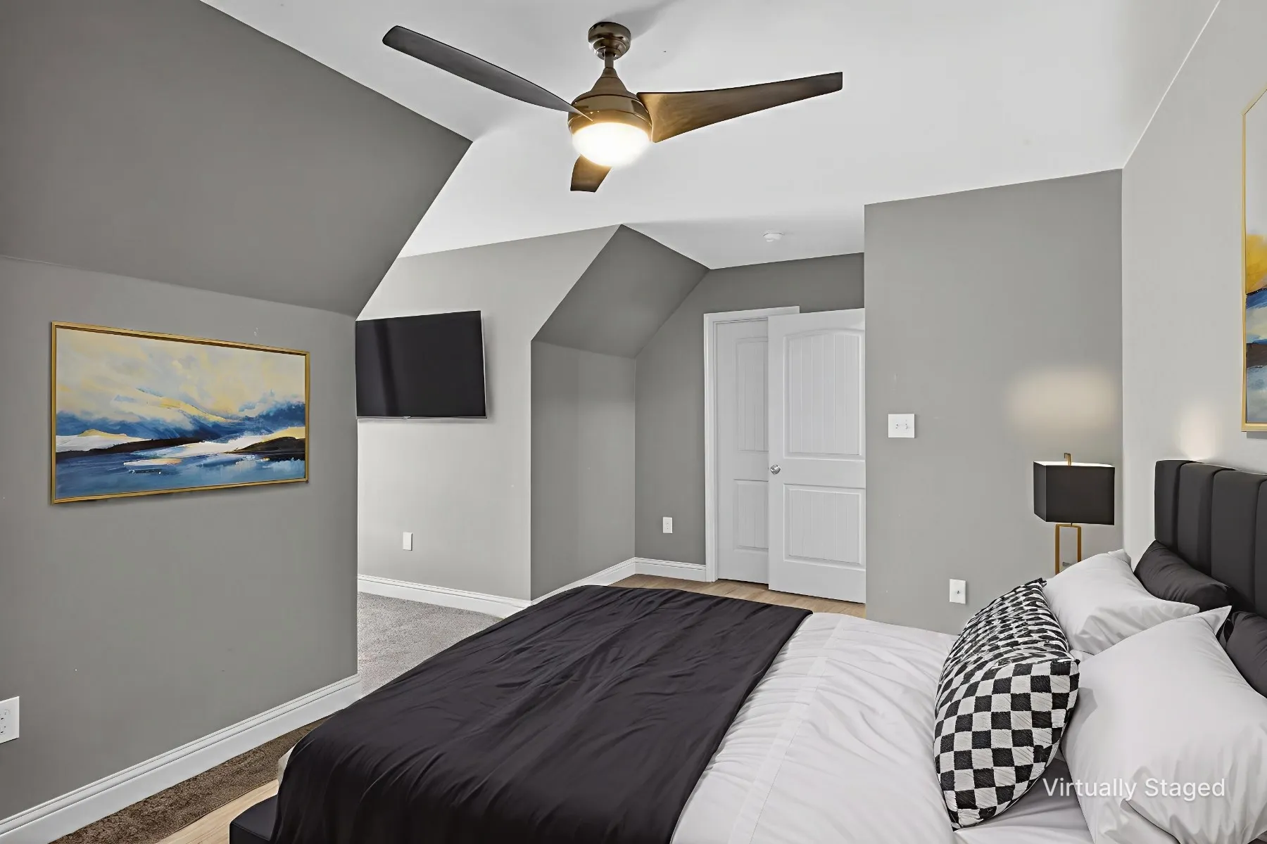 Bedroom with lofted ceiling, light carpet, and ceiling fan
