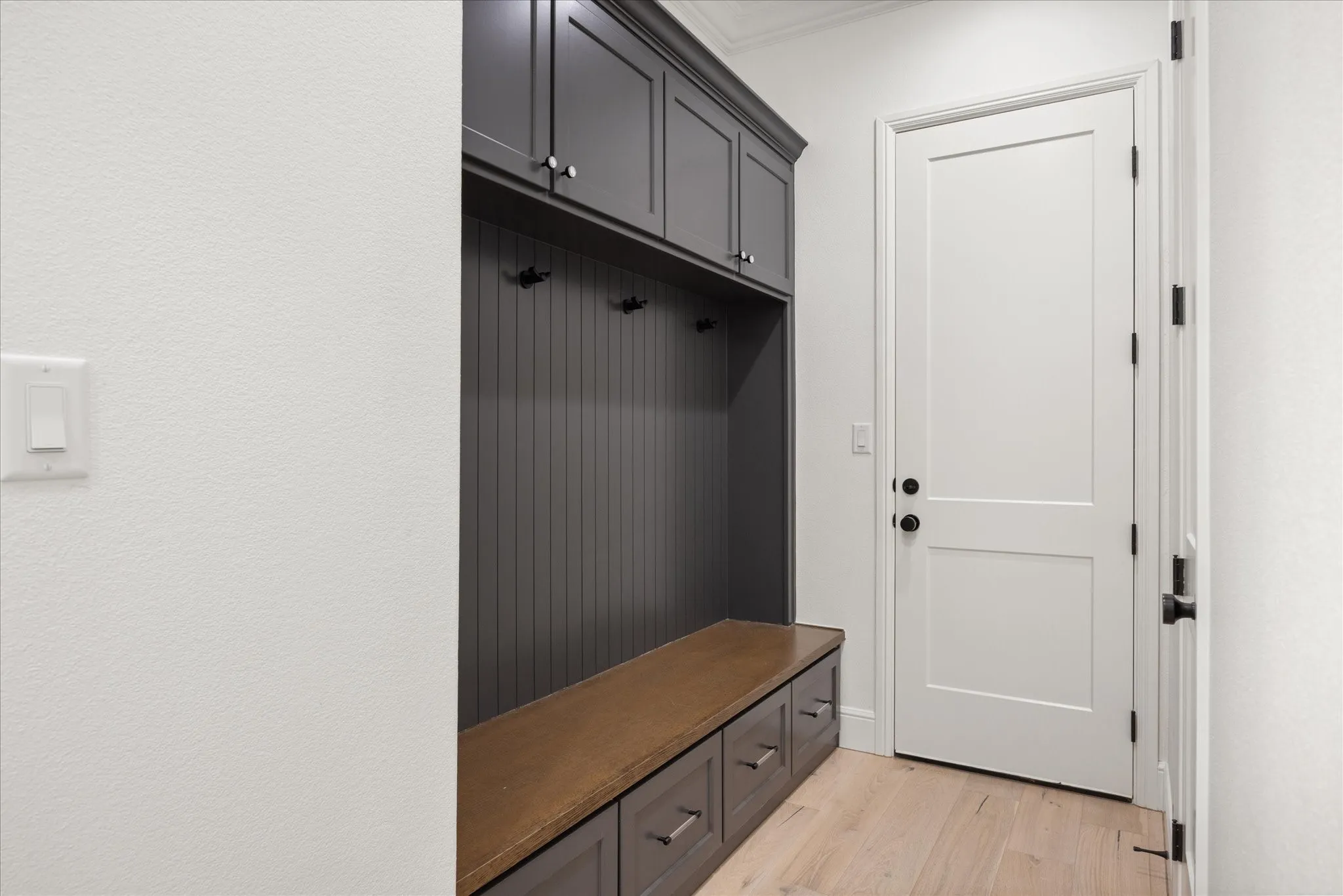 Mudroom with light wood-type flooring