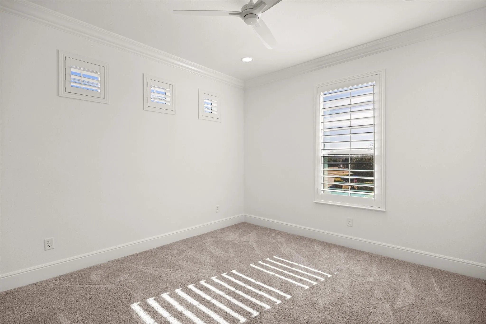 Carpeted upstairs bedroom 1 featuring crown molding, ceiling fan, and recessed lighting