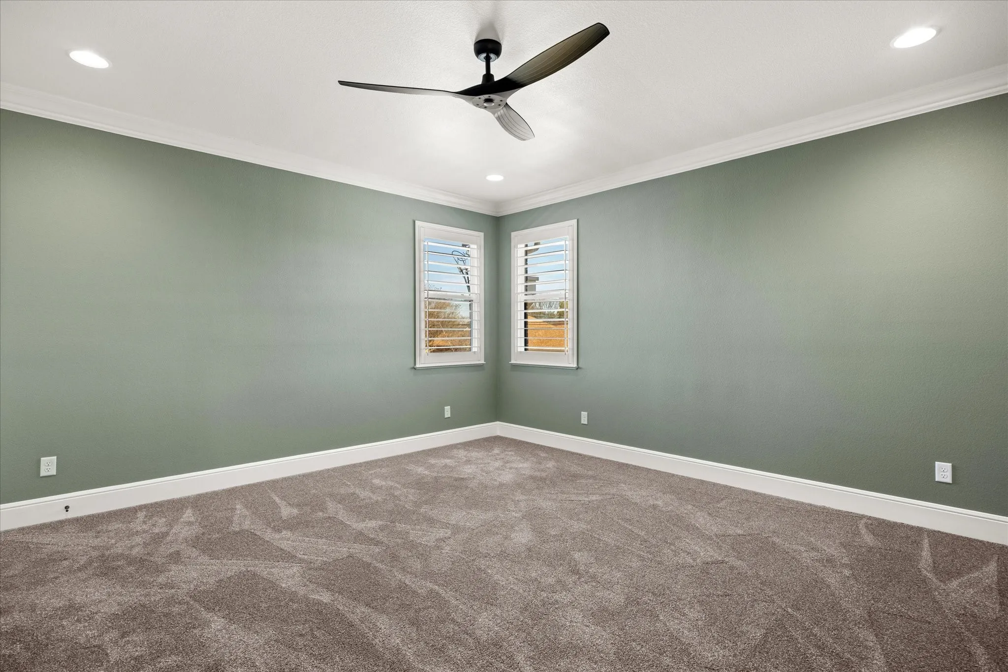Carpeted bedroom2 featuring ornamental molding, recessed lighting, and ceiling fan