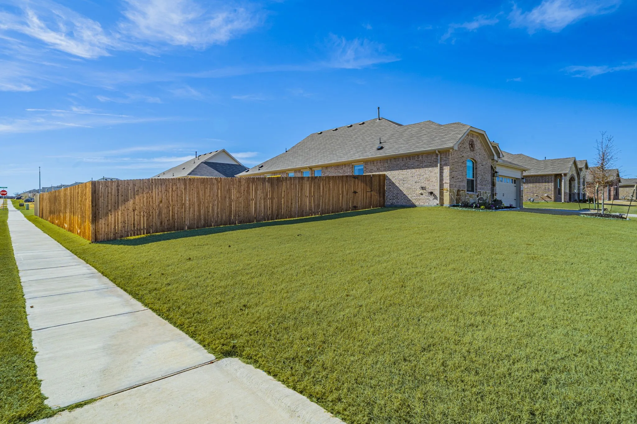 Corner lot with extra-large, fenced in backyard