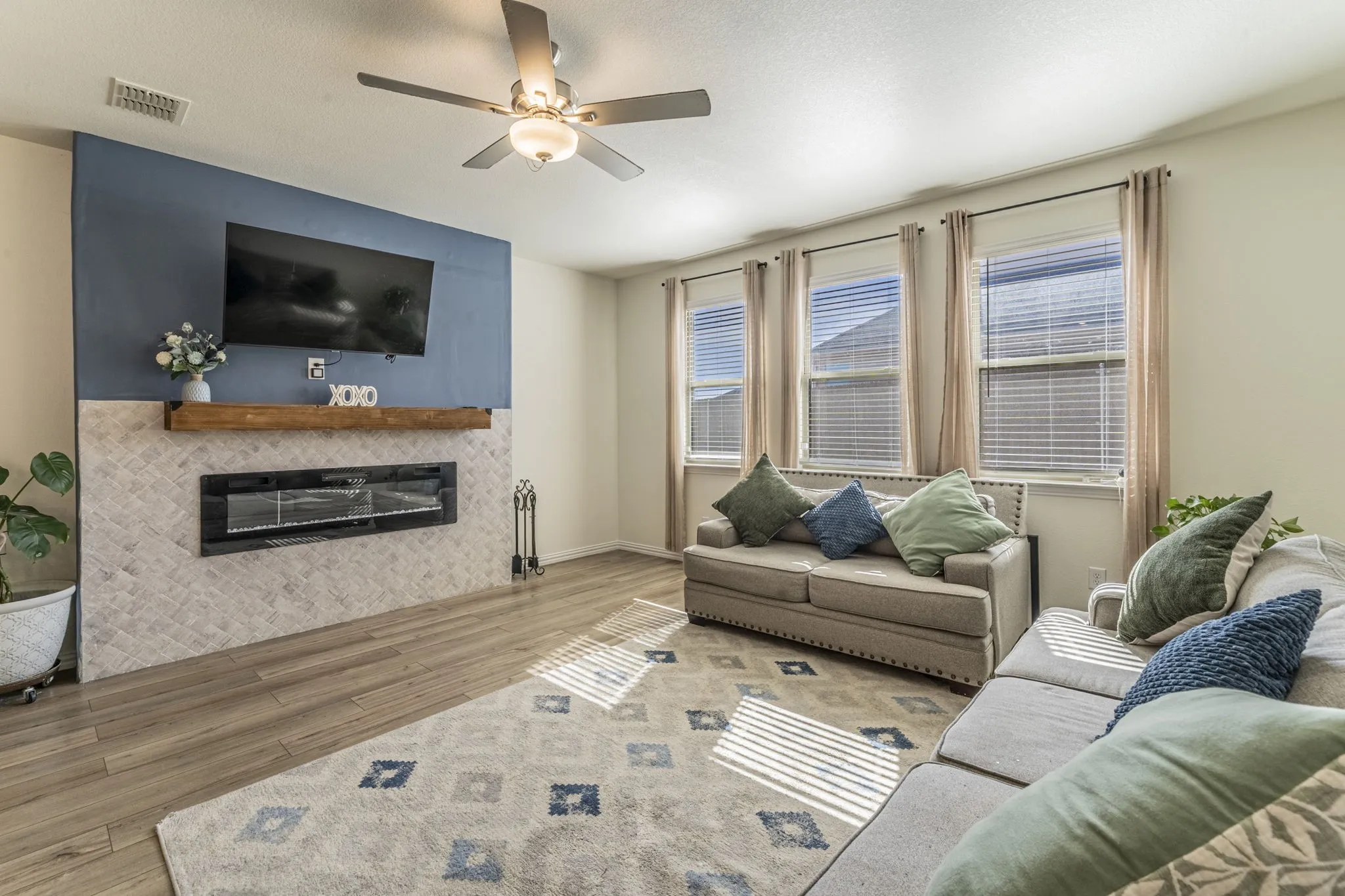 Featuring electric fireplace and large windows