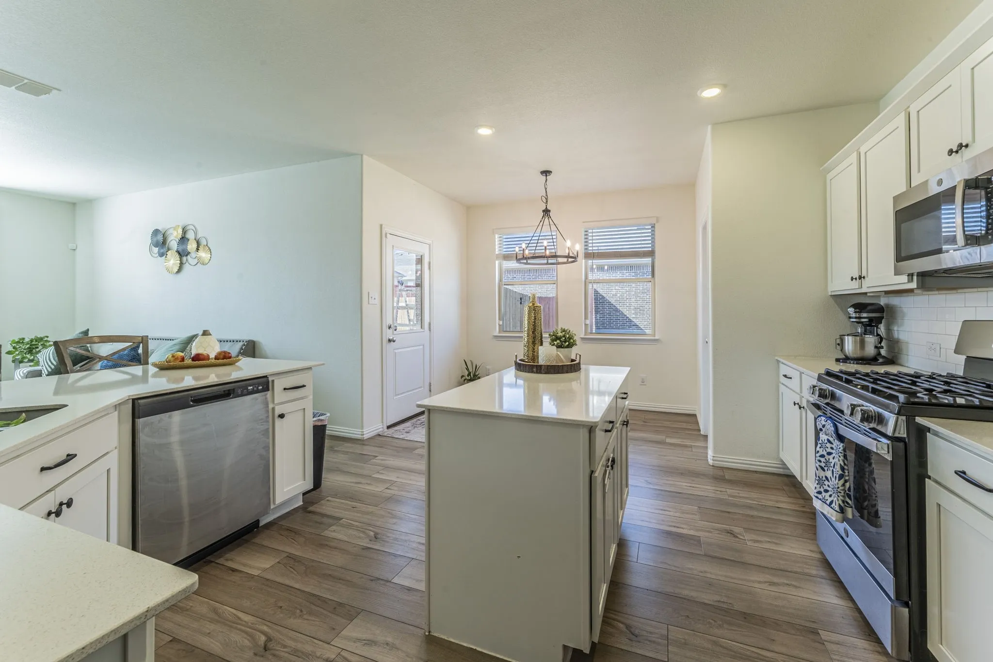Large kitchen with peninsula and island.