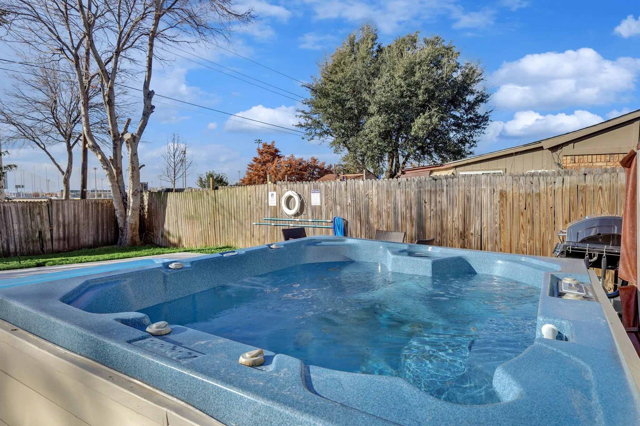 View of pool featuring a hot tub
