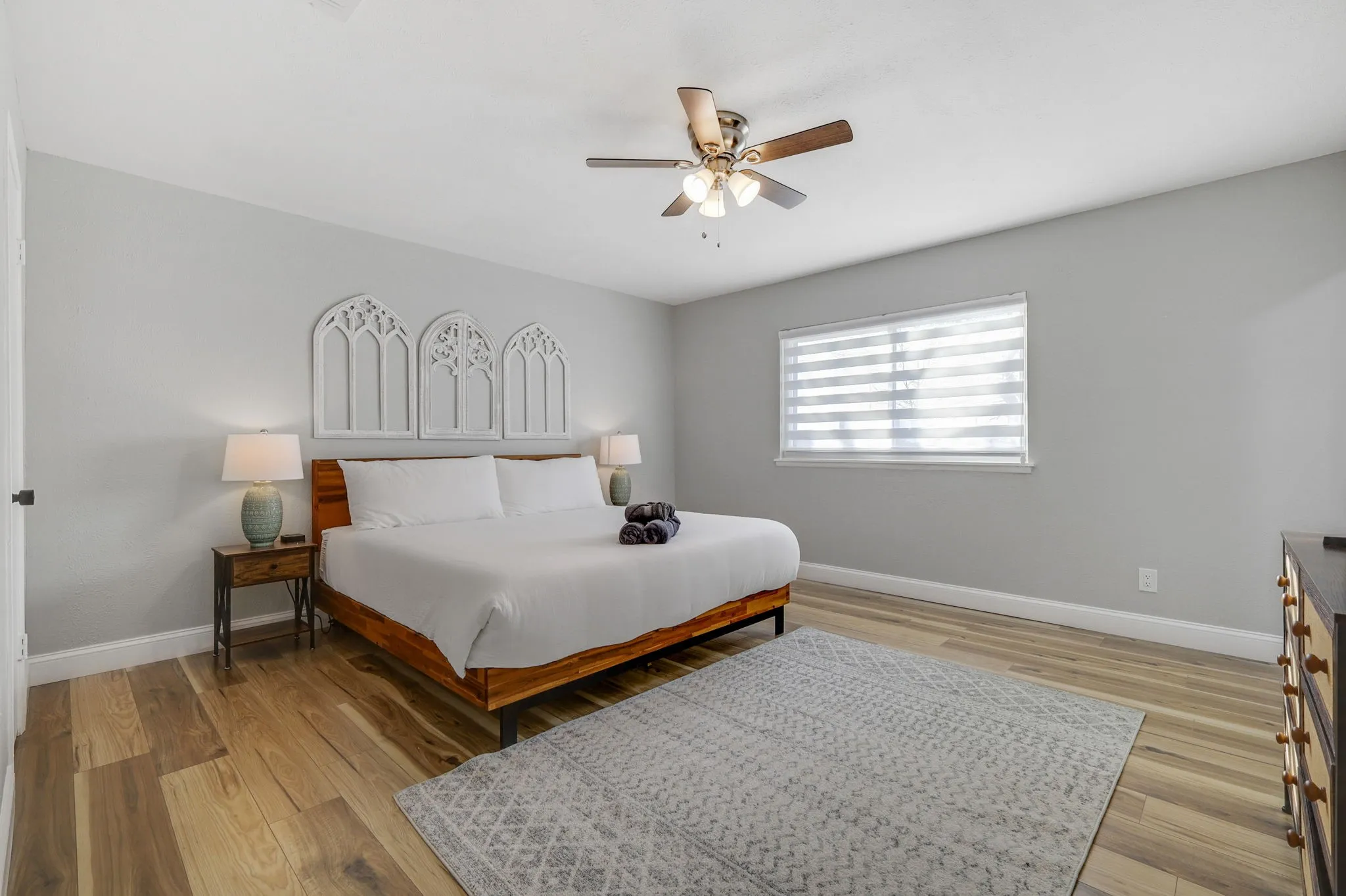 Bedroom featuring ceiling fan and light wood-type flooring