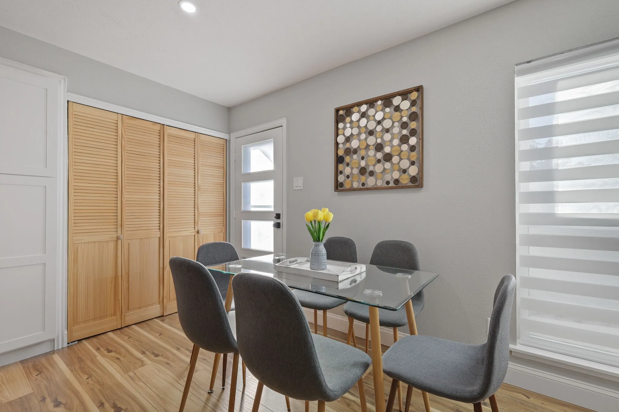 Dining space with light hardwood / wood-style floors