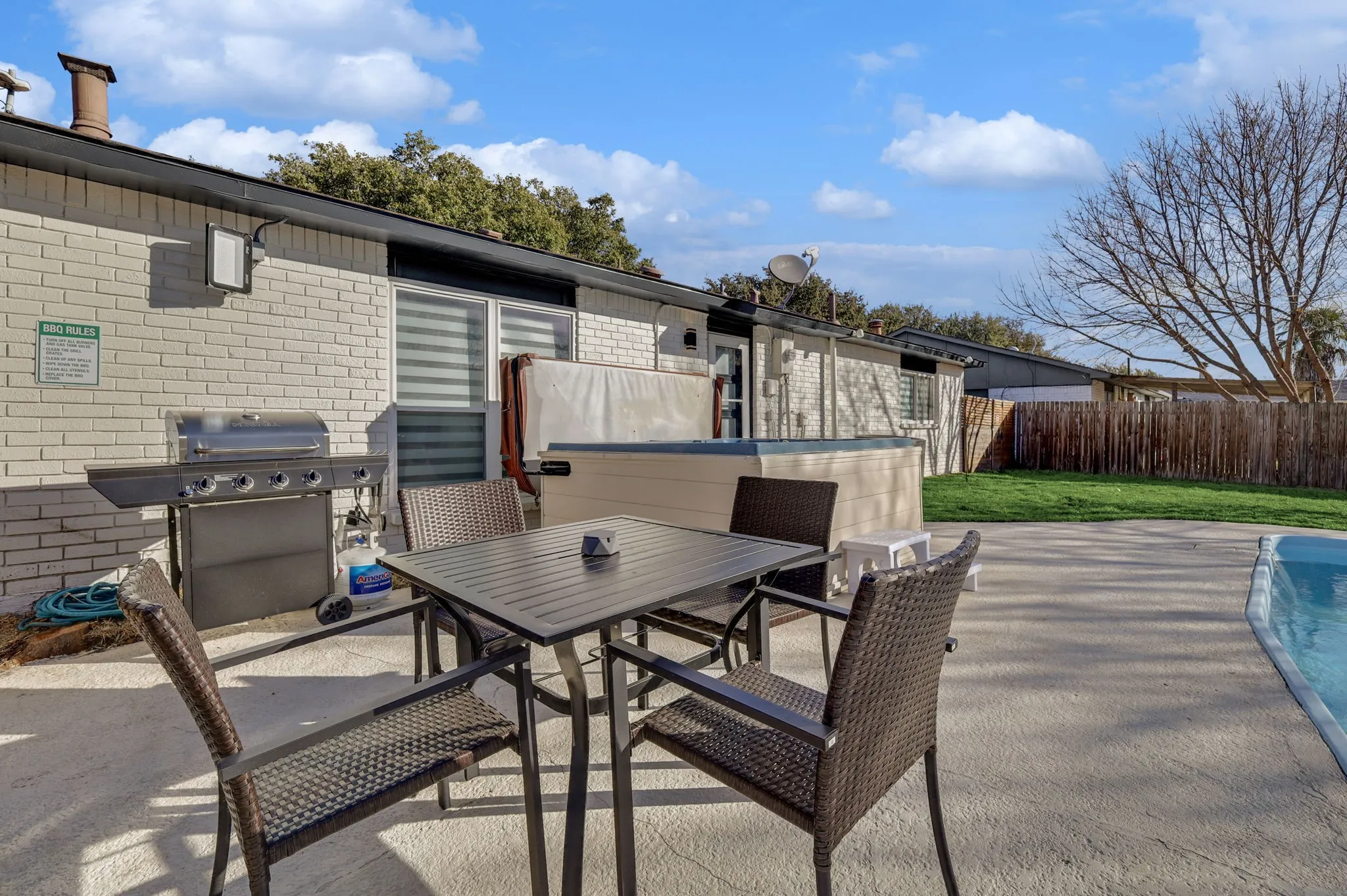 View of patio featuring area for grilling