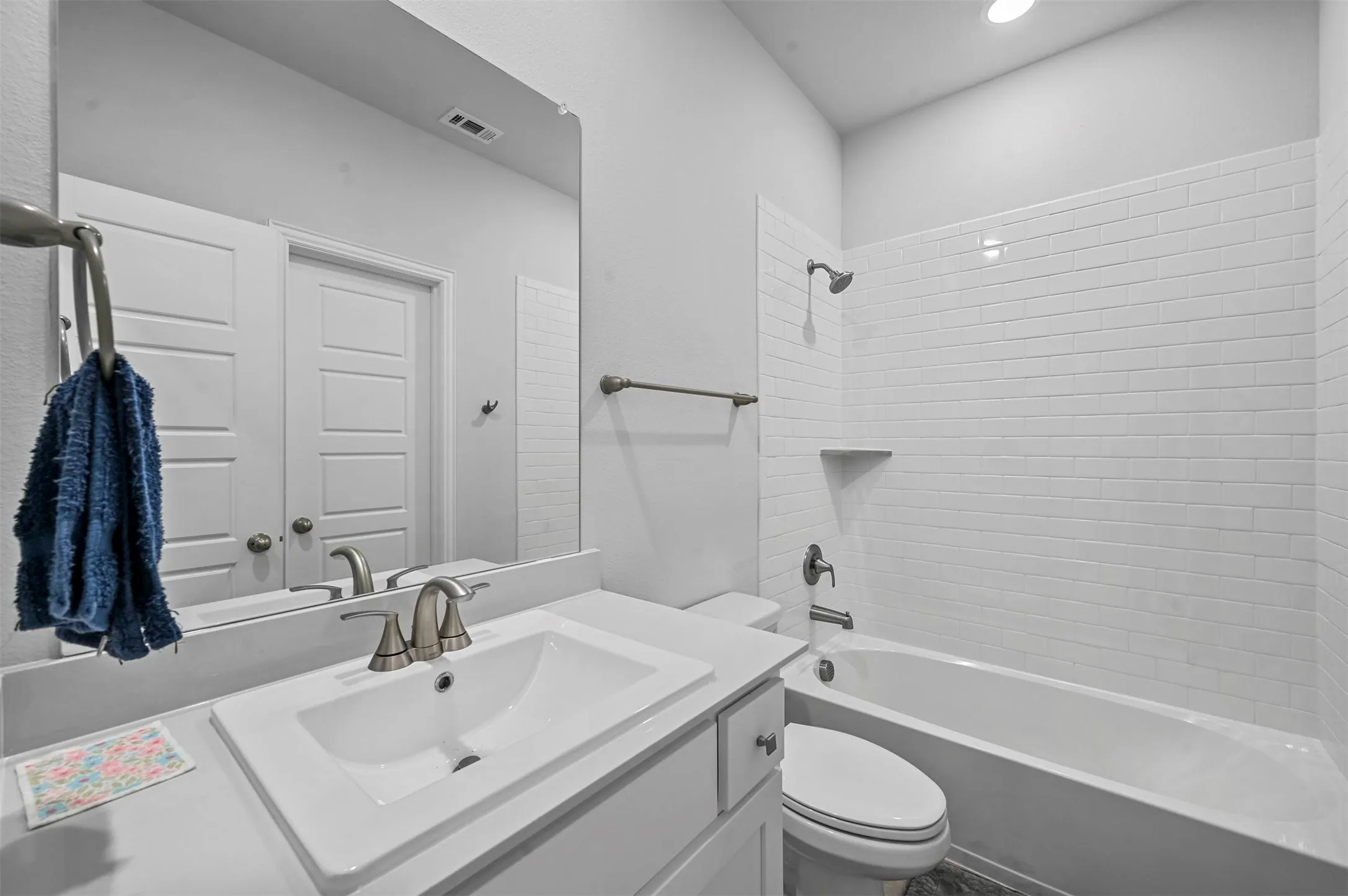 Full bath featuring  shower combination and vanity