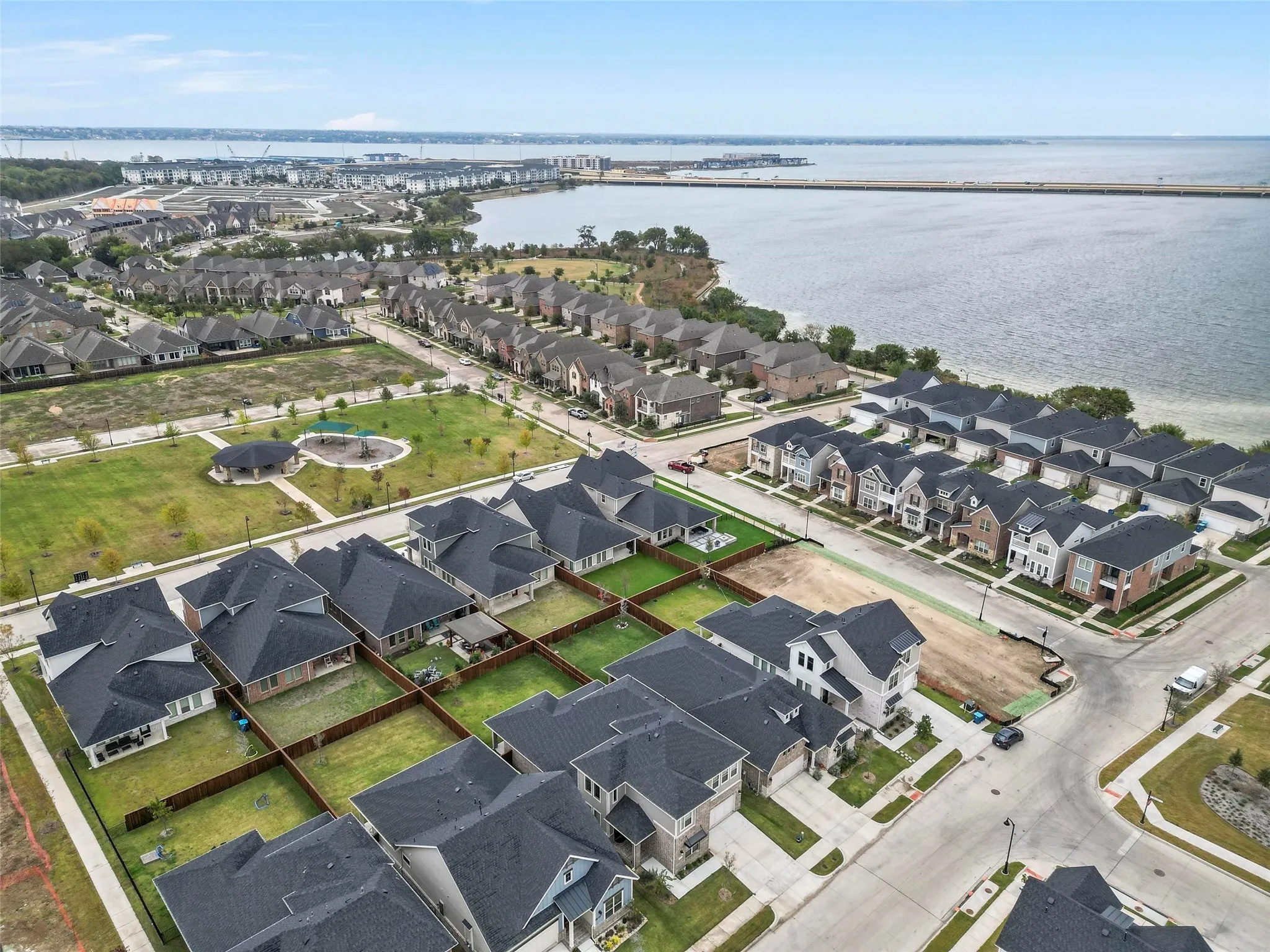 Aerial perspective of suburban area featuring a lake end of the street