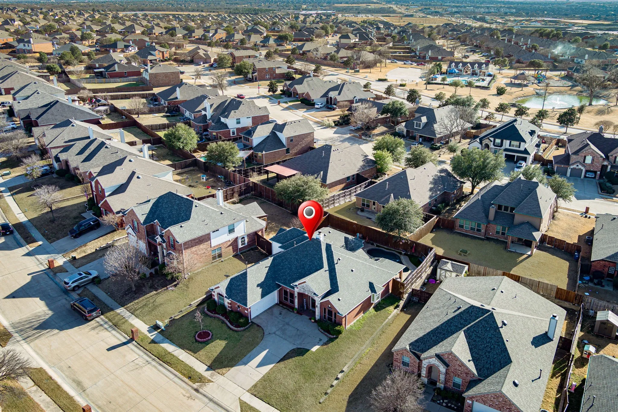 View of property location with nearby suburban area