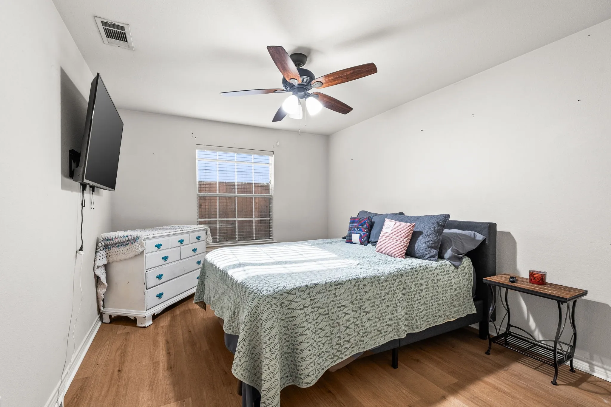 Bedroom featuring light wood-style flooring and ceiling fan