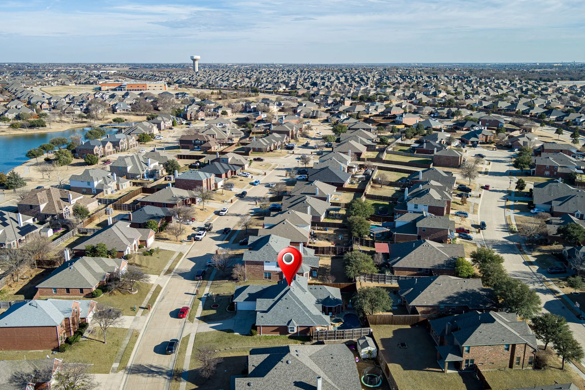 View of property location with nearby suburban area