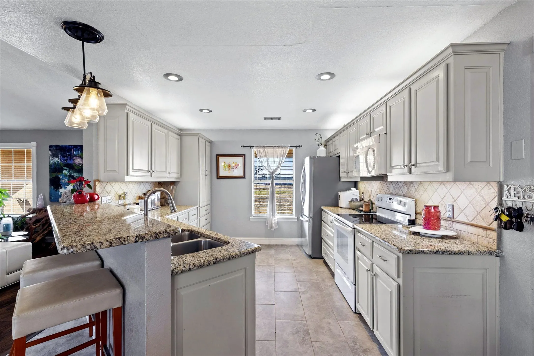 KITCHEN...Tile Floor, Granite C-Tops, Breakfast Bar