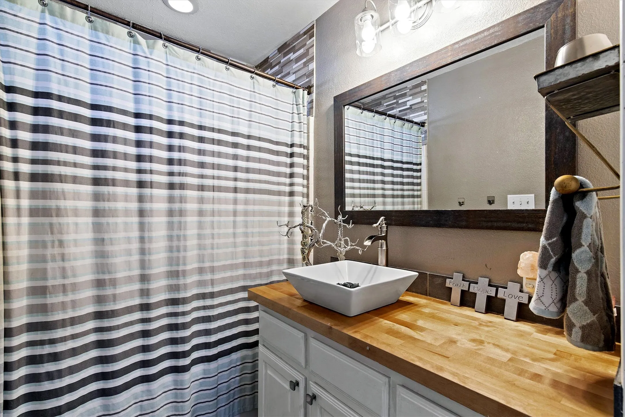 GUEST BATH...Tile Floor, Tub/Shower Combo, Linen Cabinet